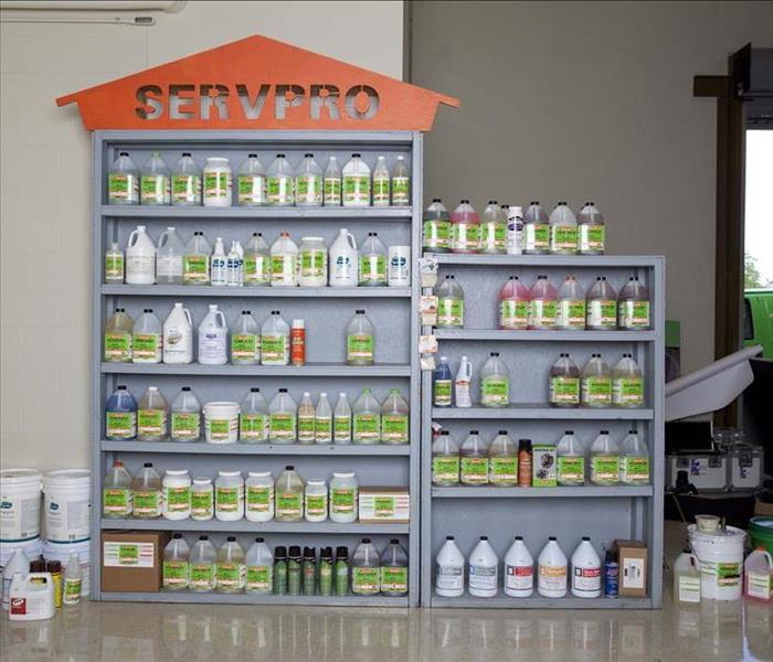 Shelf filled with SERVPRO cleaning chemicals.